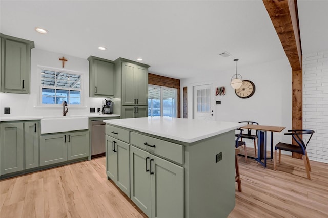 4491 Dugan Chapel Rd, Bells, TX 75414 - kitchen featuring green cabinetry, a sink, light wood-type flooring, and recessed lighting