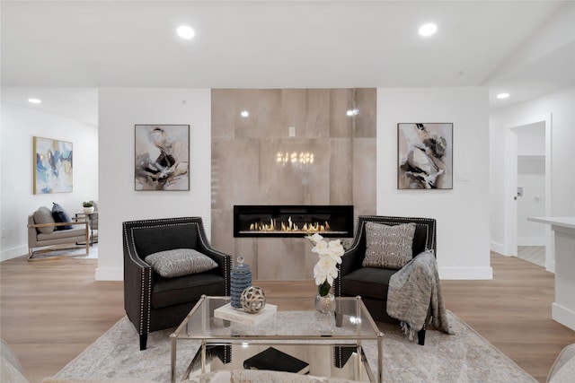 2520 Delmar Dr, Plano, TX 75075 - living area featuring wood finished floors, recessed lighting, and a large fireplace