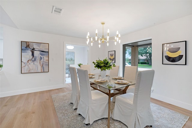 2520 Delmar Dr, Plano, TX 75075 - dining room featuring a chandelier and light wood-style floors