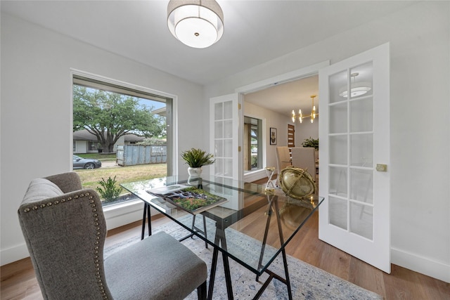 2520 Delmar Dr, Plano, TX 75075 - dining area featuring a chandelier, french doors, and wood finished floors