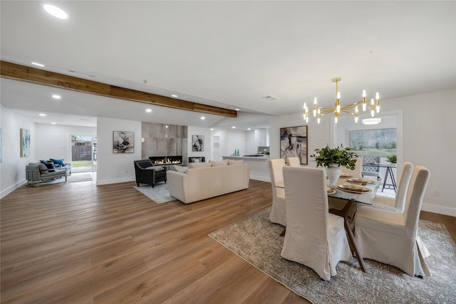 2520 Delmar Dr, Plano, TX 75075 - dining room featuring a chandelier, wood finished floors, beamed ceiling, and recessed lighting