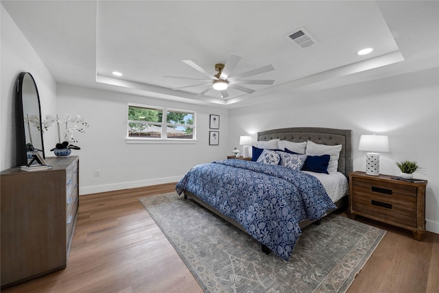 2520 Delmar Dr, Plano, TX 75075 - bedroom featuring a raised ceiling, wood finished floors, recessed lighting, and a ceiling fan