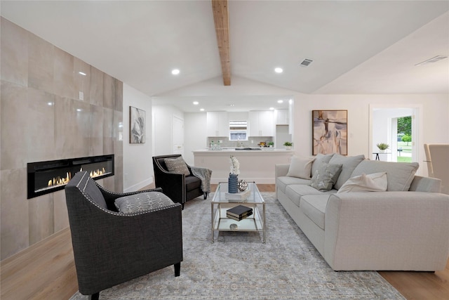 2520 Delmar Dr, Plano, TX 75075 - living room featuring light wood-type flooring, a fireplace, and recessed lighting