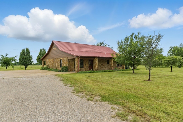 2790 Fairview Rd, Millsap, TX 76066 - single story home featuring stone siding, a front lawn, gravel driveway, and metal roof
