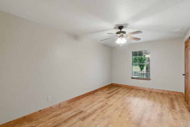 2790 Fairview Rd, Millsap, TX 76066 - spare room with light wood-style flooring, a ceiling fan, and baseboards