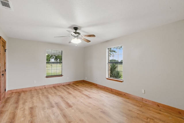 2790 Fairview Rd, Millsap, TX 76066 - empty room featuring healthy amount of natural light, light wood-style flooring, and ceiling fan