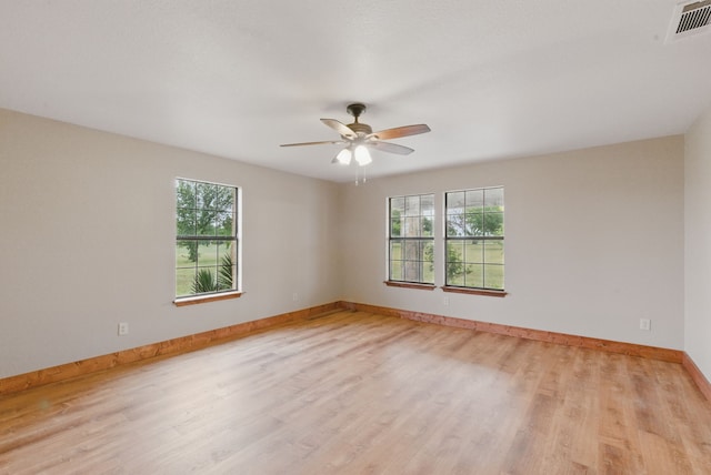 2790 Fairview Rd, Millsap, TX 76066 - unfurnished room featuring healthy amount of natural light, light wood-style floors, and baseboards
