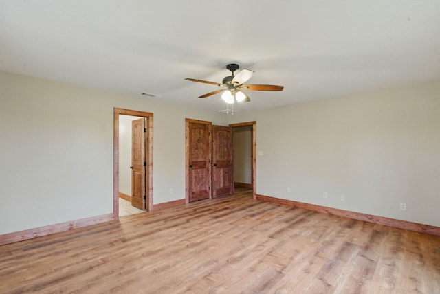 2790 Fairview Rd, Millsap, TX 76066 - unfurnished bedroom featuring light wood-type flooring, baseboards, and a ceiling fan