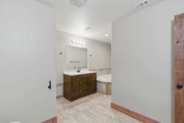 2790 Fairview Rd, Millsap, TX 76066 - bathroom featuring a bath, vanity, tile patterned floors, and baseboards