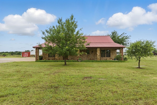 2790 Fairview Rd, Millsap, TX 76066 - view of front of house with a front yard, metal roof, stone siding, and driveway