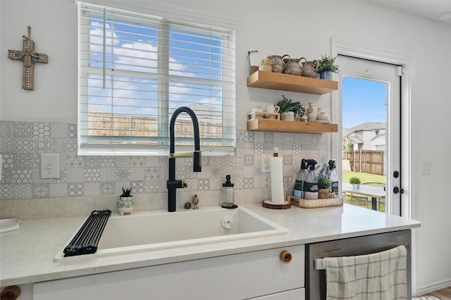 1943 Applewood Trl, Forney, TX 75126 - kitchen featuring a sink, light countertops, and backsplash