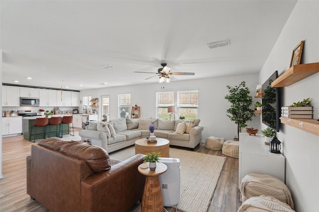 1943 Applewood Trl, Forney, TX 75126 - living area featuring a ceiling fan, light wood finished floors, and recessed lighting