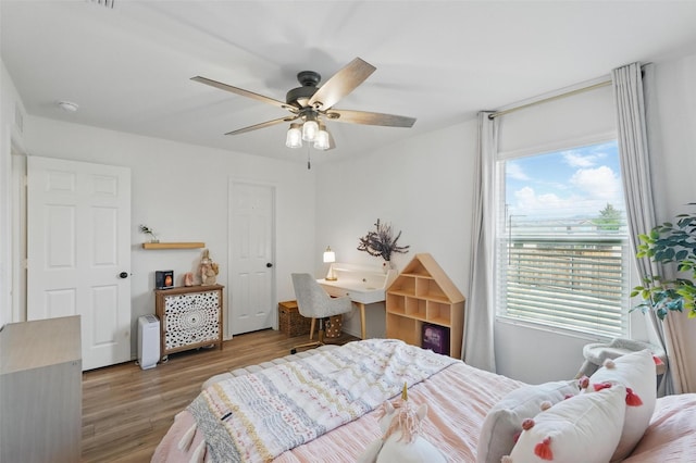 1943 Applewood Trl, Forney, TX 75126 - bedroom featuring wood finished floors and a ceiling fan