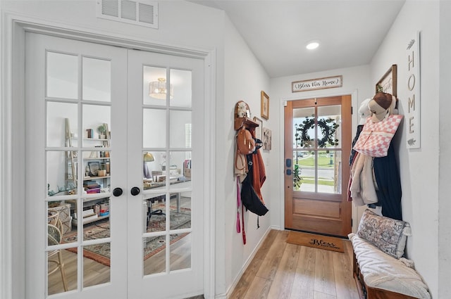 1943 Applewood Trl, Forney, TX 75126 - doorway featuring light wood-style floors, french doors, and baseboards