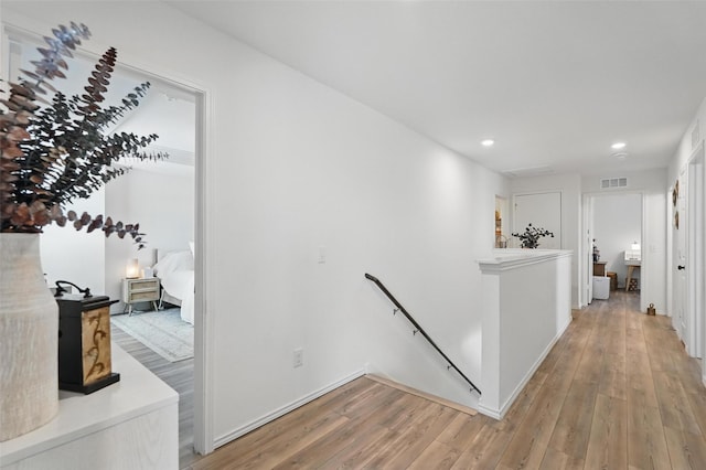 1943 Applewood Trl, Forney, TX 75126 - hallway with an upstairs landing, light wood-style floors, recessed lighting, and baseboards
