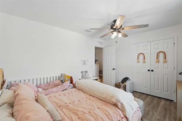 1943 Applewood Trl, Forney, TX 75126 - bedroom with wood finished floors, ceiling fan, and a closet