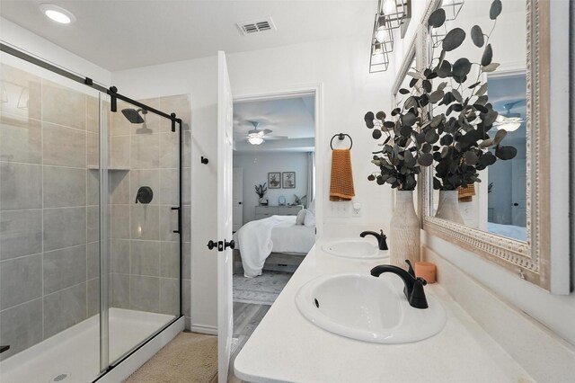 1943 Applewood Trl, Forney, TX 75126 - ensuite bathroom featuring a stall shower, double vanity, and ceiling fan