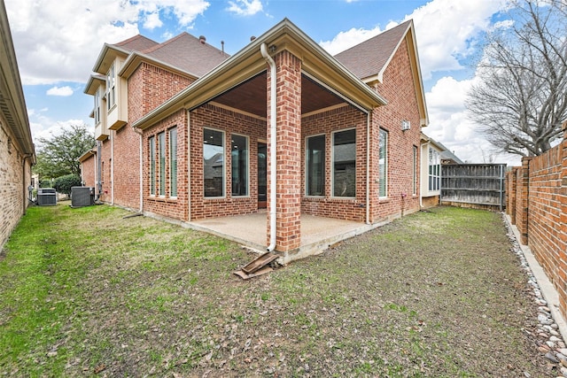 5061 Copperglen Cir, Colleyville, TX 76034 - rear view of property with brick siding, central air condition unit, a patio, and a shingled roof