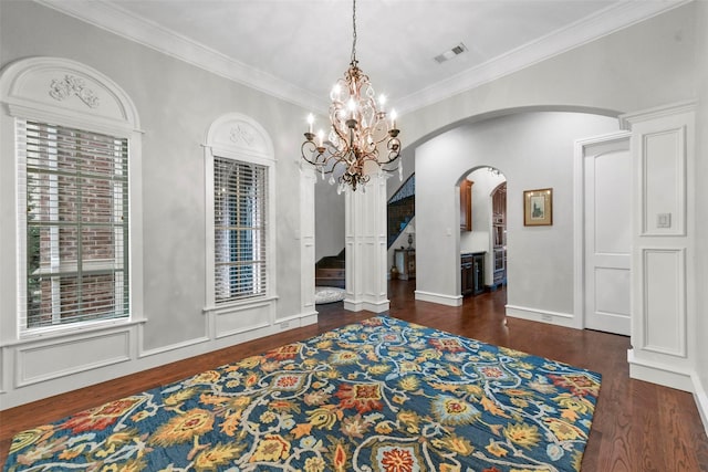 5061 Copperglen Cir, Colleyville, TX 76034 - dining area featuring arched walkways, wood finished floors, ornamental molding, stairway, and a chandelier