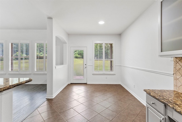 230 Sweetheart Ln, Longview, TX 75605 - unfurnished dining area featuring healthy amount of natural light, tile patterned flooring, baseboards, and recessed lighting