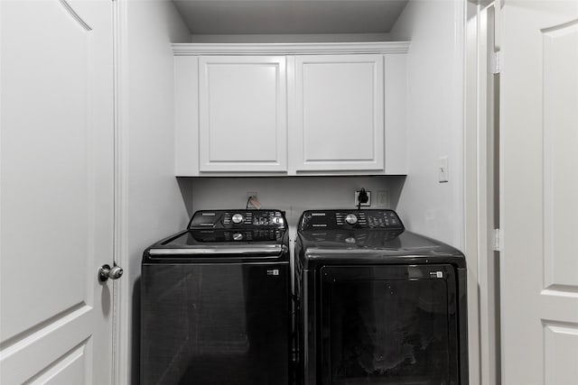 230 Sweetheart Ln, Longview, TX 75605 - laundry room with washing machine and clothes dryer and cabinet space