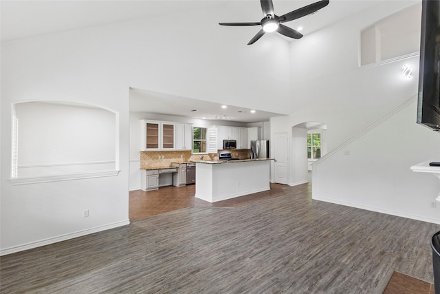 230 Sweetheart Ln, Longview, TX 75605 - living room with dark wood-type flooring, a ceiling fan, arched walkways, baseboards, and recessed lighting