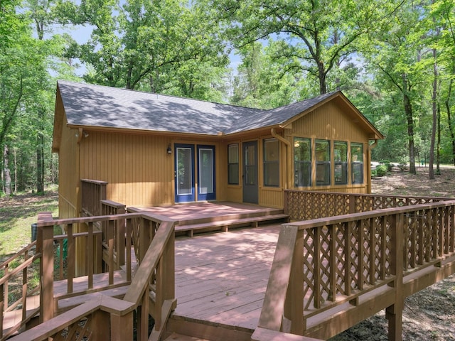 136 Lariat Loop, Holly Lake Ranch, TX 75765 - wooden terrace featuring a sunroom