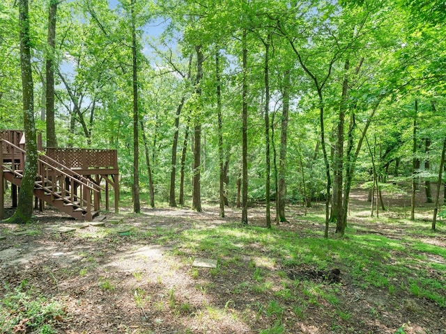 136 Lariat Loop, Holly Lake Ranch, TX 75765 - view of yard with stairway and a deck