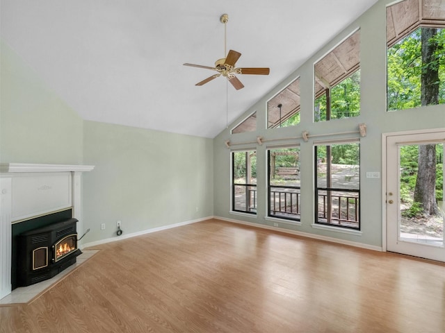 136 Lariat Loop, Holly Lake Ranch, TX 75765 - unfurnished living room featuring light wood-type flooring, high vaulted ceiling, a ceiling fan, and baseboards