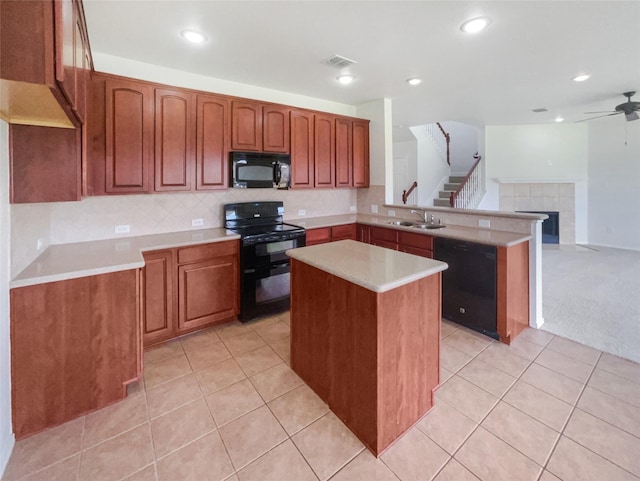 1017 Mule Deer Rd, Forney, TX 75126 - kitchen with black appliances, a sink, a peninsula, a ceiling fan, and light countertops