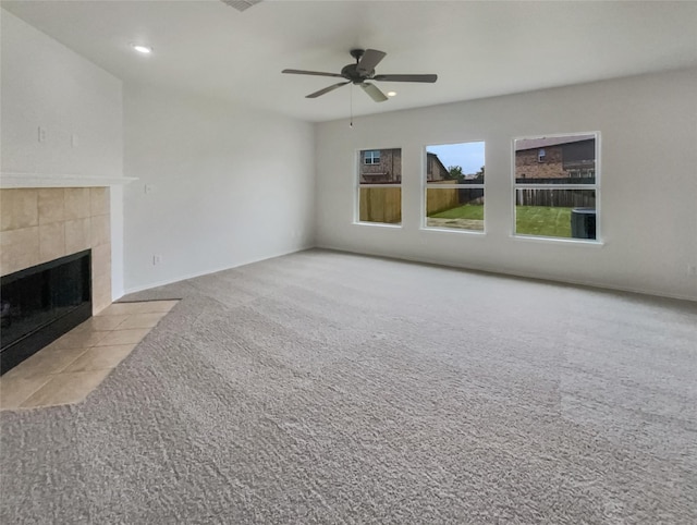 1017 Mule Deer Rd, Forney, TX 75126 - unfurnished living room with carpet, a tile fireplace, ceiling fan, and recessed lighting