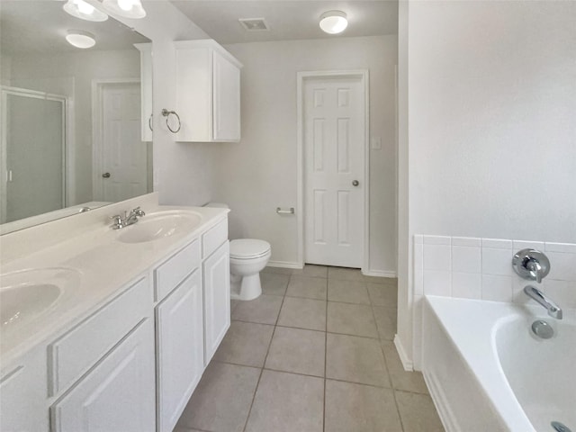 1017 Mule Deer Rd, Forney, TX 75126 - full bath with tile patterned flooring, a garden tub, a shower stall, double vanity, and toilet