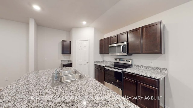 12525 Tarres Ct, Lorena, TX 76655 - kitchen with appliances with stainless steel finishes, a sink, dark brown cabinetry, recessed lighting, and lofted ceiling
