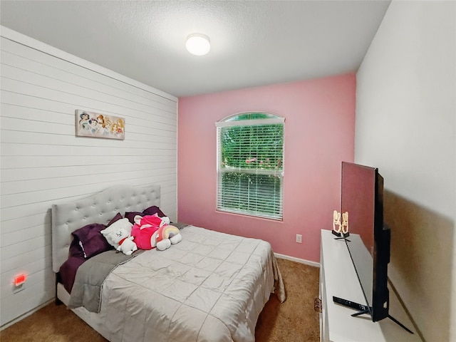 6920 Cruiser Ln, Fort Worth, TX 76179 - bedroom featuring carpet floors and wood walls