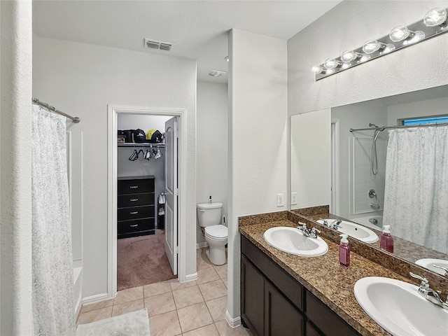 6920 Cruiser Ln, Fort Worth, TX 76179 - bathroom featuring toilet, double vanity, tile patterned floors, shower / bath combination with curtain, and a spacious closet