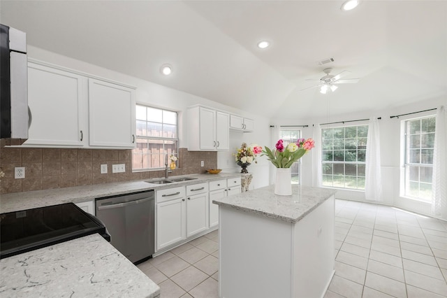 3072 Bigleaf Dr, Little Elm, TX 75068 - kitchen featuring dishwasher, a sink, lofted ceiling, light tile patterned flooring, and a ceiling fan