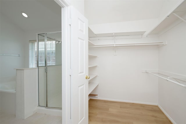3072 Bigleaf Dr, Little Elm, TX 75068 - spacious closet with wood finished floors