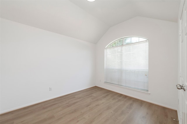 3072 Bigleaf Dr, Little Elm, TX 75068 - spare room featuring light wood finished floors and lofted ceiling