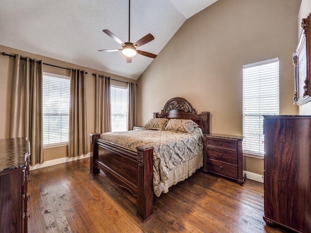 3968 Valez Dr, Carrollton, TX 75007 - bedroom featuring vaulted ceiling, dark wood finished floors, baseboards, and multiple windows