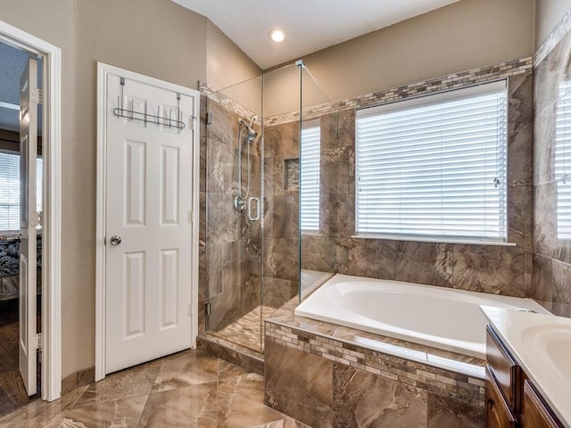 3968 Valez Dr, Carrollton, TX 75007 - bathroom featuring a garden tub, marble tiled floors, a stall shower, and vanity