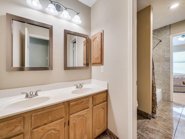 3968 Valez Dr, Carrollton, TX 75007 - bathroom featuring double vanity and tub / shower combination