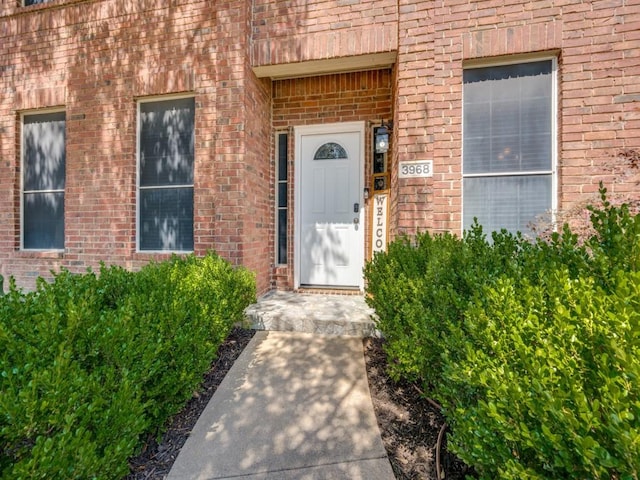 3968 Valez Dr, Carrollton, TX 75007 - doorway to property featuring brick siding