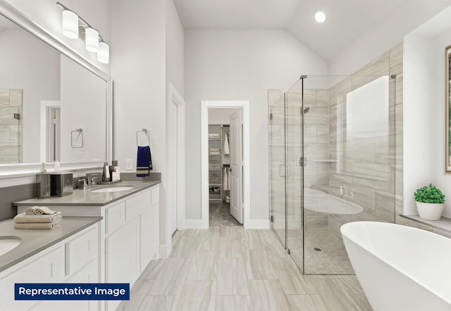 5212 Deep Creek Dr, Fort Worth, TX 76179 - bathroom featuring a stall shower, a freestanding bath, vanity, lofted ceiling, and a walk in closet