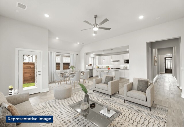 5212 Deep Creek Dr, Fort Worth, TX 76179 - living room featuring light wood finished floors, ceiling fan, recessed lighting, baseboards, and vaulted ceiling