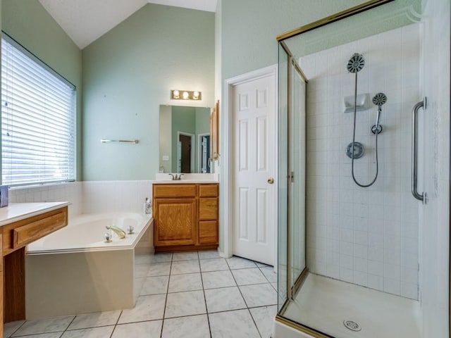 2614 Tourette Ct, Mckinney, TX 75070 - bathroom with a shower stall, vanity, a bath, tile patterned flooring, and vaulted ceiling