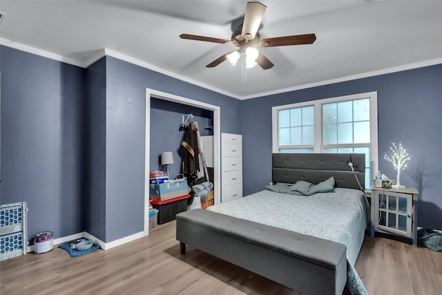1316 Elm St, Bonham, TX 75418 - bedroom with wood finished floors, ornamental molding, baseboards, ceiling fan, and a closet