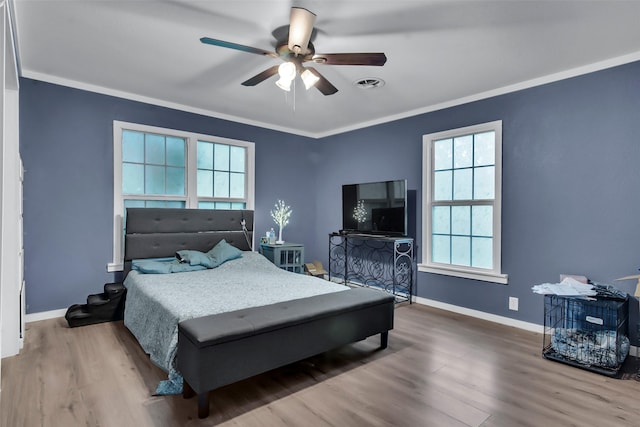 1316 Elm St, Bonham, TX 75418 - bedroom with wood finished floors, baseboards, ornamental molding, and ceiling fan