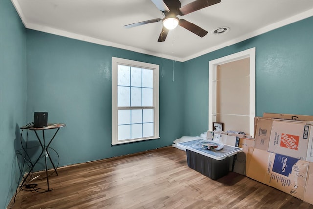 1316 Elm St, Bonham, TX 75418 - office area with ceiling fan and wood finished floors
