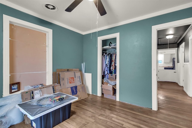1316 Elm St, Bonham, TX 75418 - bedroom featuring attic access, wood finished floors, a closet, and a ceiling fan