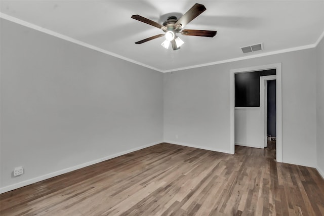 1316 Elm St, Bonham, TX 75418 - empty room featuring ornamental molding, a ceiling fan, wood finished floors, and baseboards